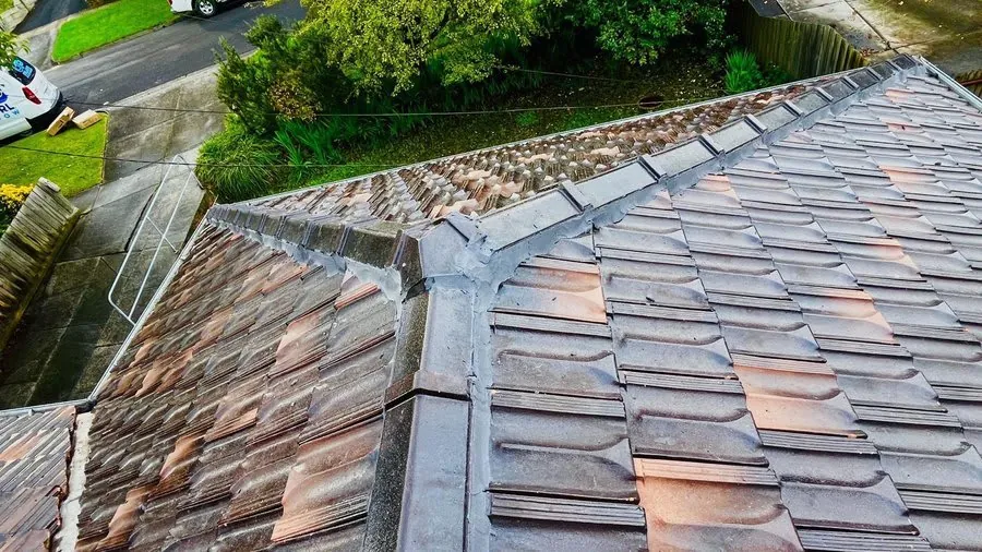 Moss-covered tiled roof in Melbourne that is a candidate for restoration